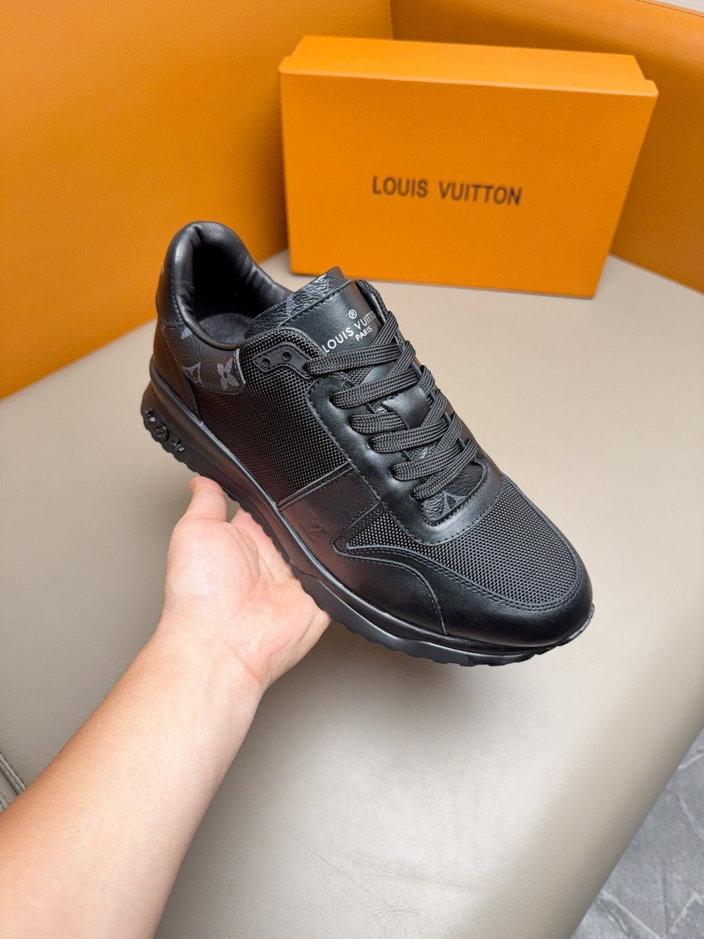Louis Vuitton Black Leather & Mesh Sneakers — model