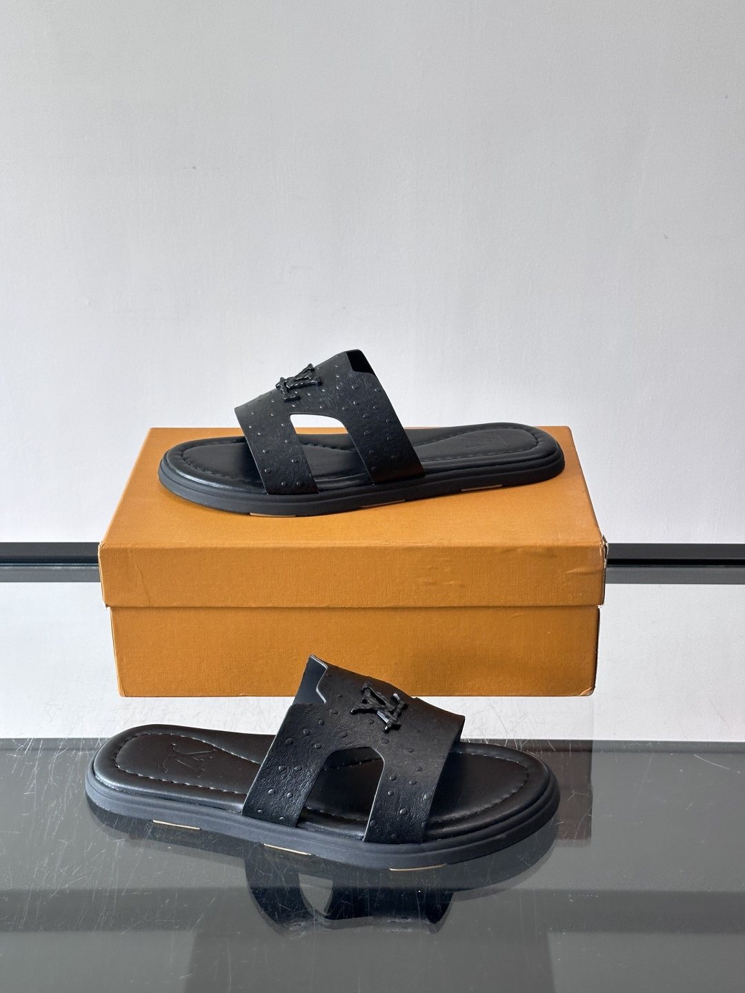 Louis Vuitton Black Embossed Slide Sandals — side
